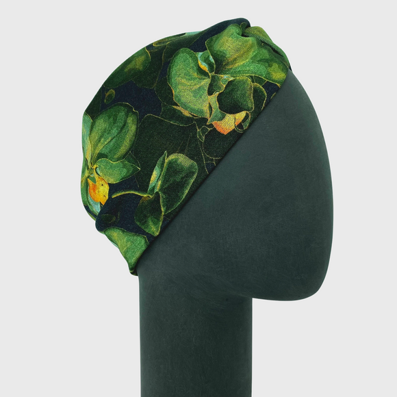 Grünes Stirnband mit Knoten und Orchideen